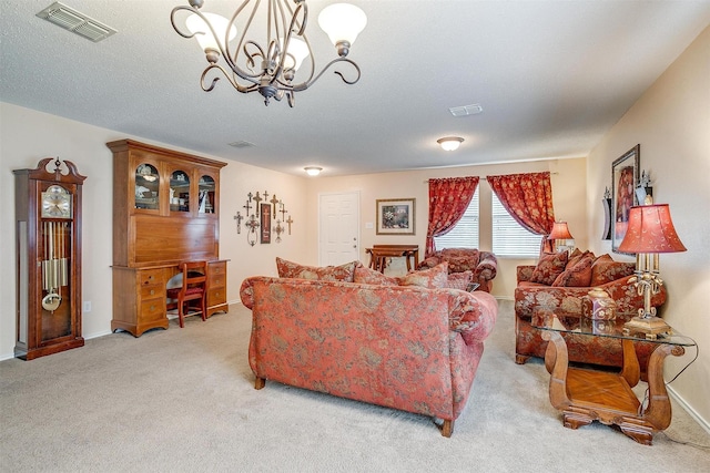 living room featuring light colored carpet, a textured ceiling, and a chandelier