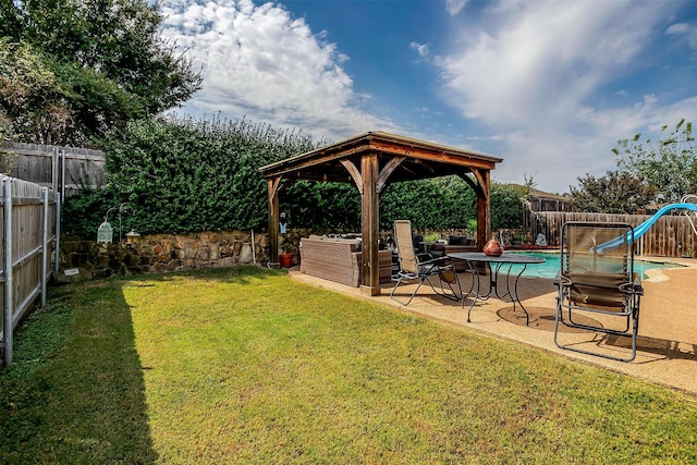 view of yard with a fenced in pool, a gazebo, and a patio