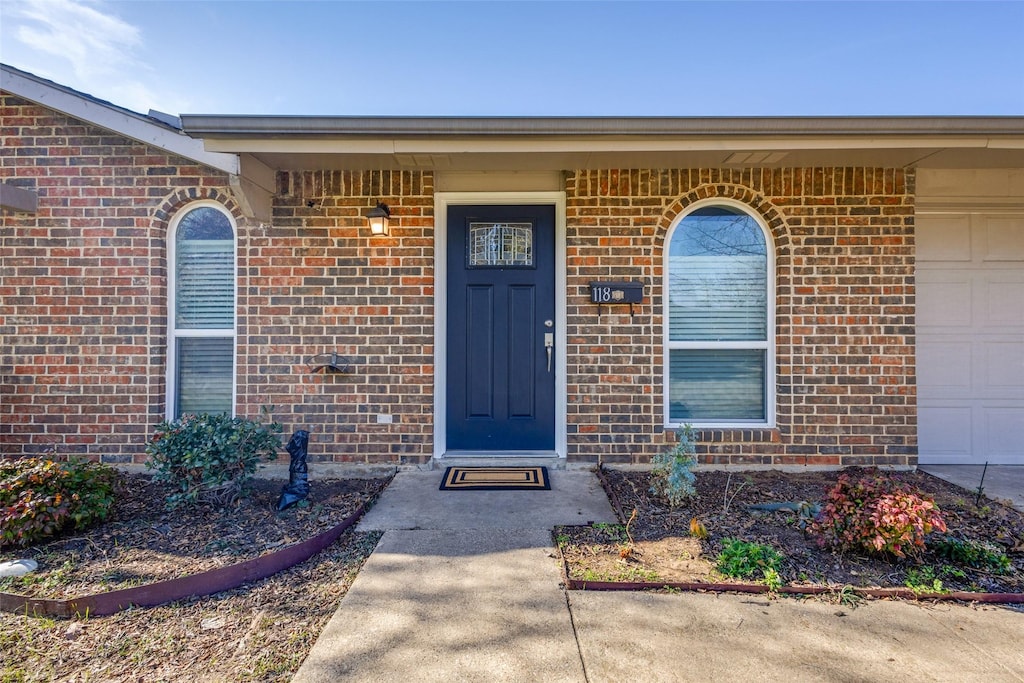 property entrance featuring a garage