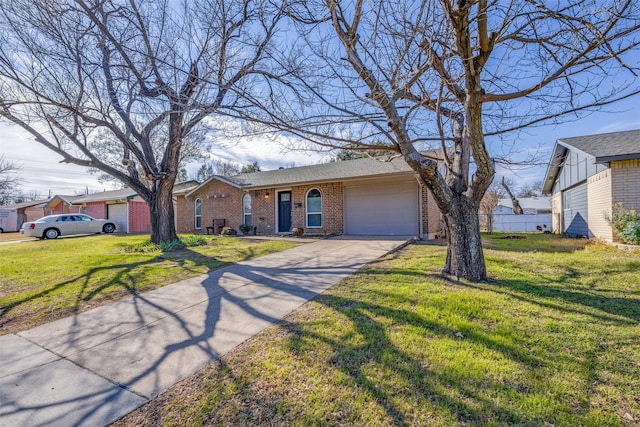 ranch-style home with a garage and a front lawn