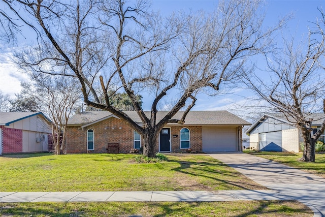 view of front of property with a garage and a front yard