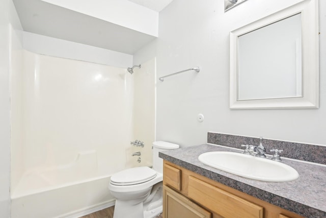 full bathroom with washtub / shower combination, vanity, and toilet