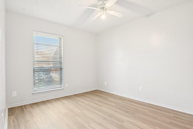 unfurnished room featuring ceiling fan and light wood-type flooring