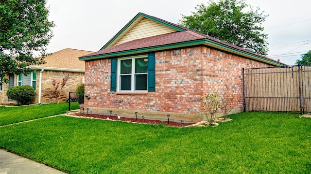 view of home's exterior with a yard