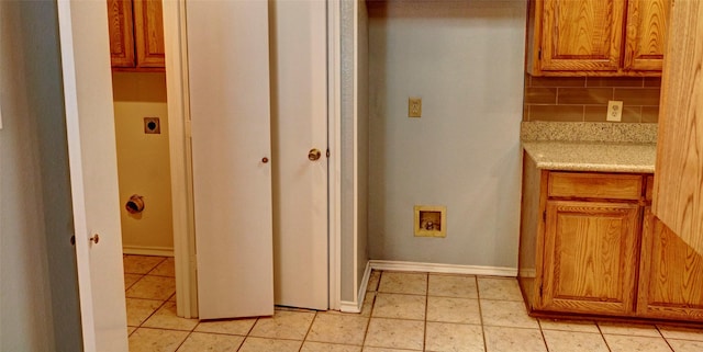 bathroom with decorative backsplash and tile patterned flooring