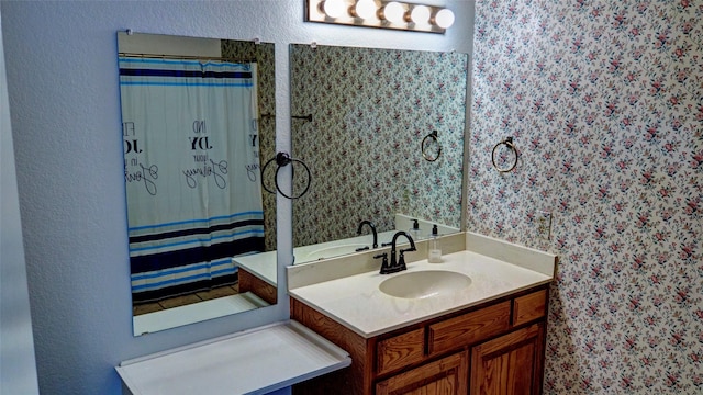 bathroom featuring vanity and a shower with shower curtain