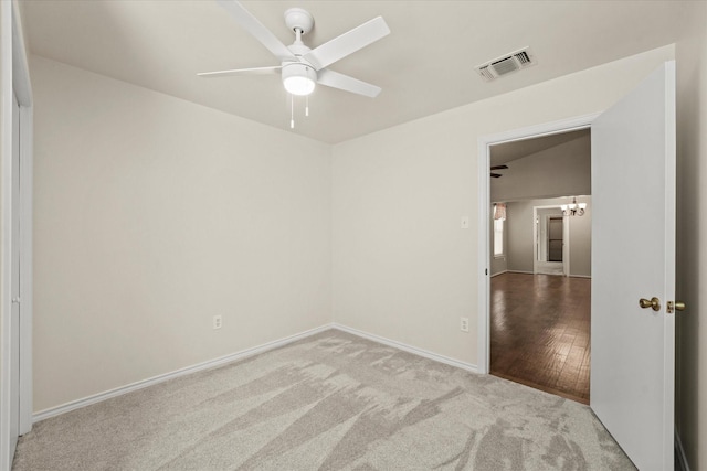 unfurnished bedroom with a ceiling fan, carpet, visible vents, and baseboards