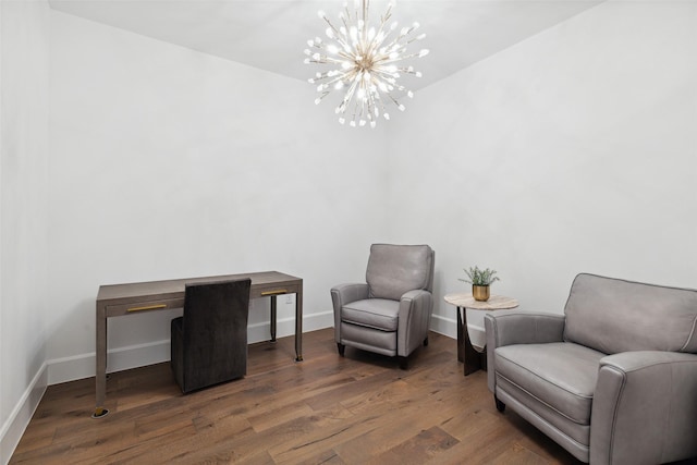 living area with dark hardwood / wood-style floors and a chandelier