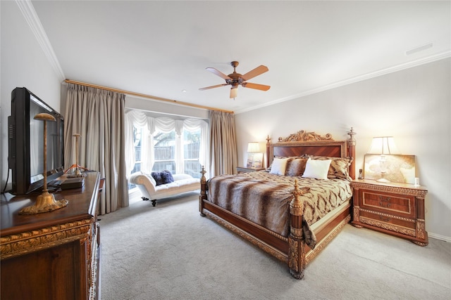 bedroom with ceiling fan, ornamental molding, and carpet flooring