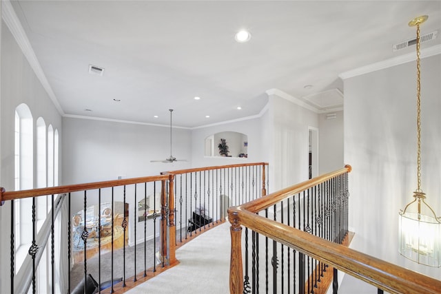 hall with carpet flooring and crown molding