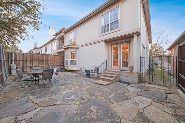 back of house featuring a patio