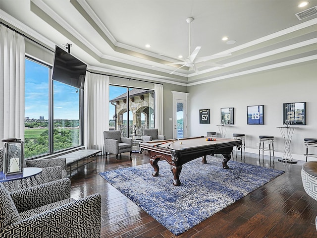 rec room with ceiling fan, dark hardwood / wood-style floors, a raised ceiling, crown molding, and pool table