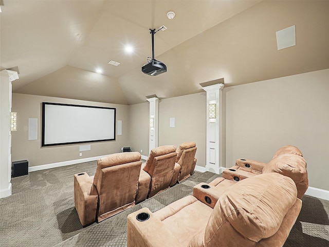 carpeted cinema featuring vaulted ceiling and ornate columns