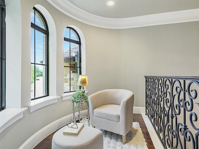 sitting room featuring hardwood / wood-style floors and crown molding