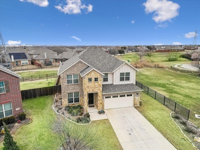 view of front of house with a garage and a front lawn