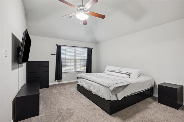 bedroom with vaulted ceiling, light carpet, and ceiling fan