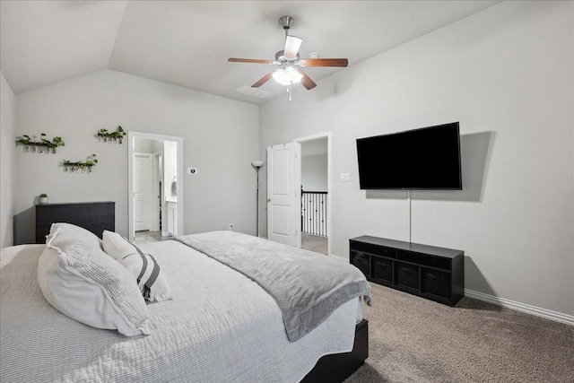 bedroom with connected bathroom, vaulted ceiling, ceiling fan, and carpet flooring