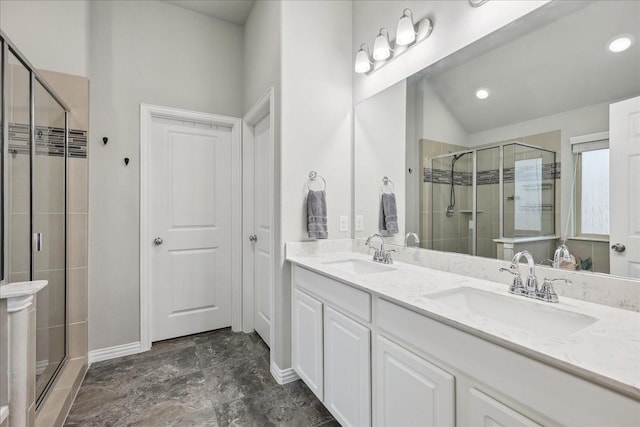 bathroom featuring vanity and an enclosed shower