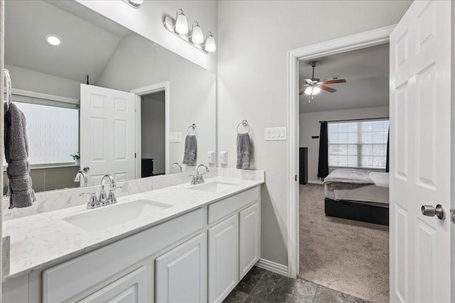 bathroom with vanity, vaulted ceiling, and ceiling fan