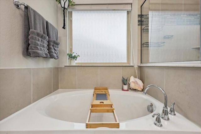 bathroom featuring a washtub