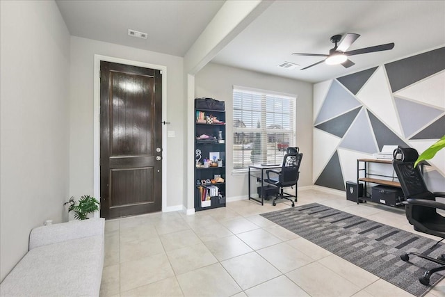 tiled office featuring ceiling fan