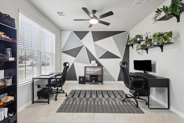 tiled home office featuring ceiling fan