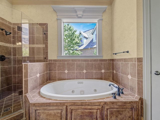 bathroom featuring shower with separate bathtub