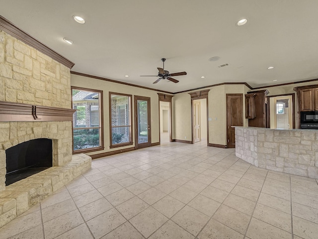 unfurnished living room featuring ceiling fan, ornamental molding, and a fireplace