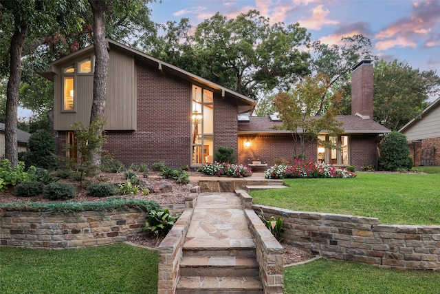 view of front of home with a lawn