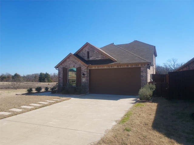 view of front of home with a garage and driveway