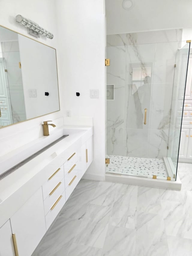 bathroom featuring vanity and an enclosed shower