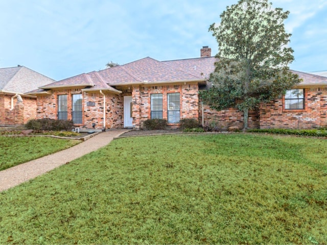 ranch-style home featuring a front yard