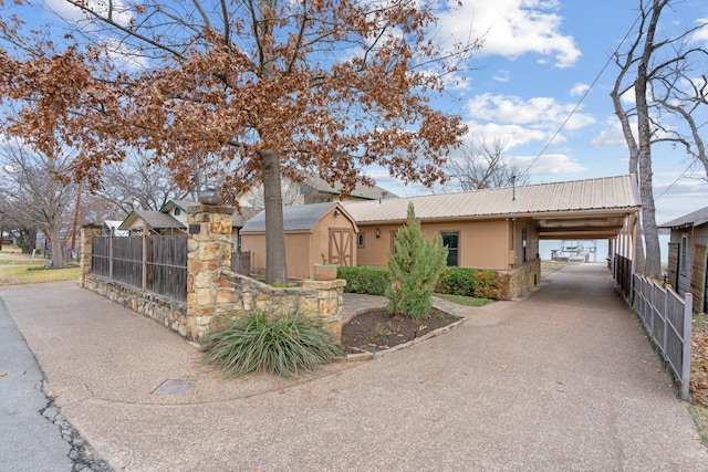 view of front of property with a carport