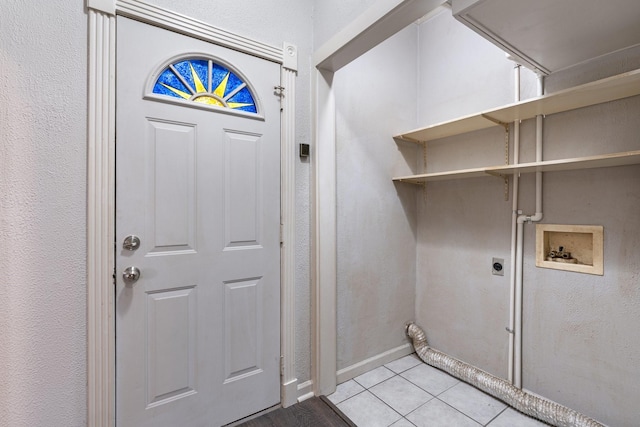 washroom featuring light tile patterned floors, hookup for a washing machine, and electric dryer hookup