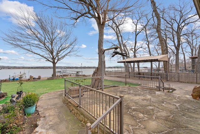 view of patio featuring a water view and a gazebo