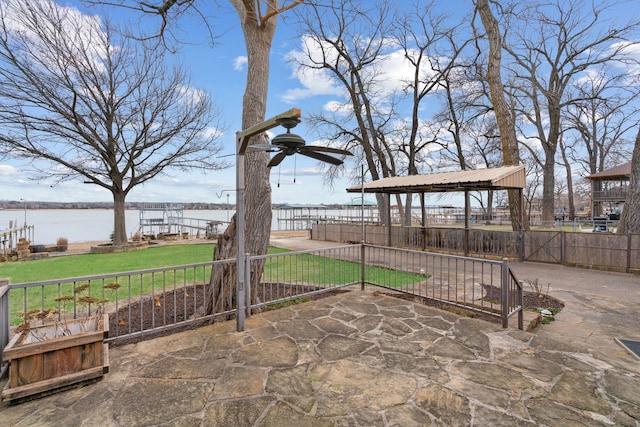 view of patio / terrace featuring a water view and a gazebo