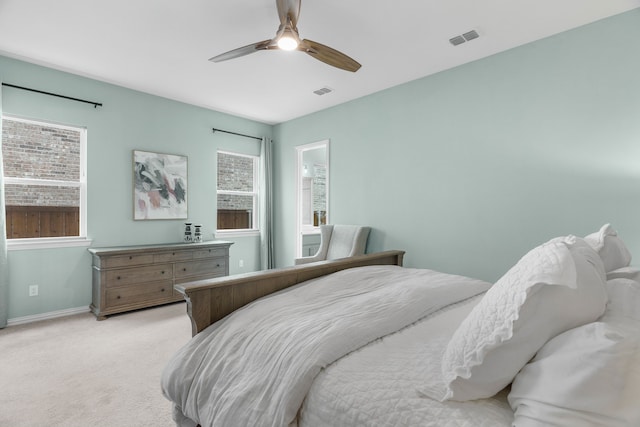 bedroom featuring ceiling fan and light colored carpet