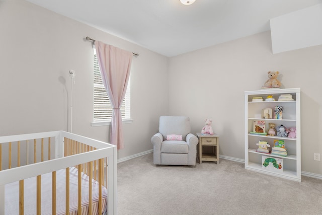 bedroom with light carpet and a crib