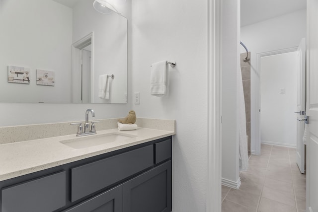 bathroom with vanity, a shower, and tile patterned floors