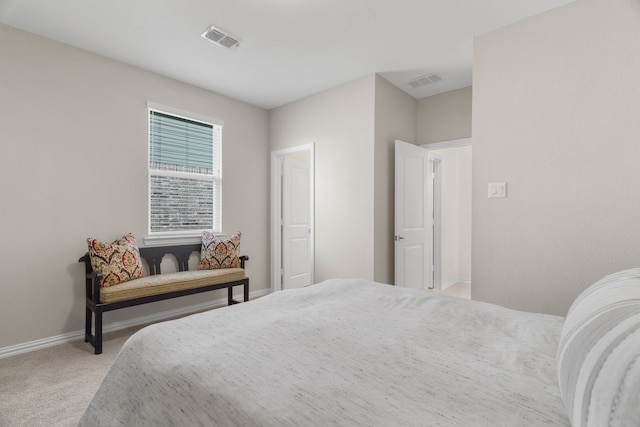 bedroom with light colored carpet