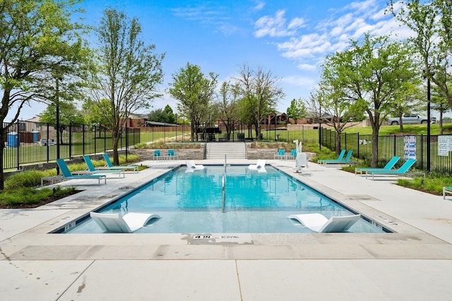 view of swimming pool featuring a patio area