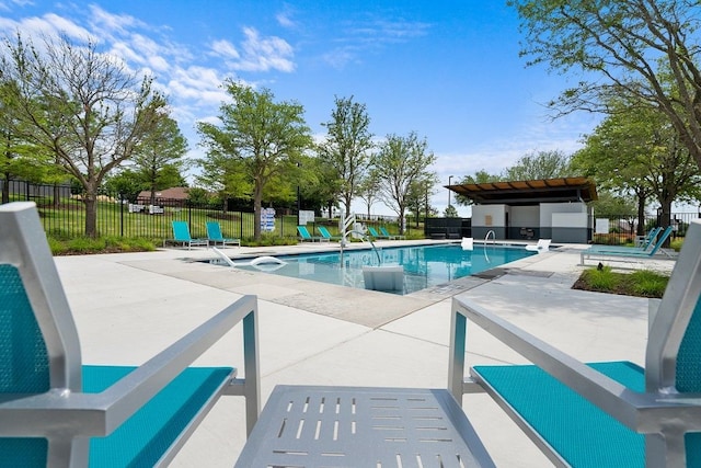 view of swimming pool featuring a patio area