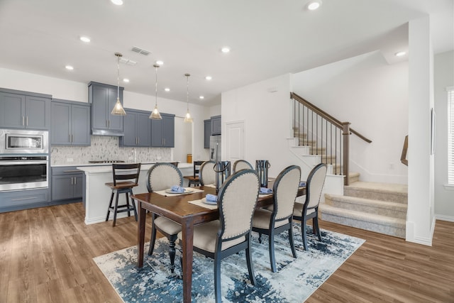 dining room with hardwood / wood-style floors