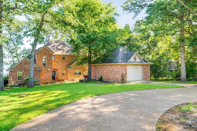 view of front of home featuring a garage and a front yard