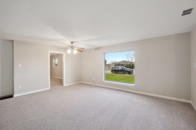 carpeted empty room with ceiling fan