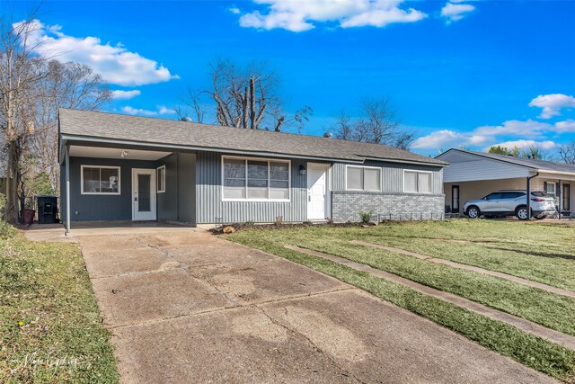 ranch-style house featuring a carport