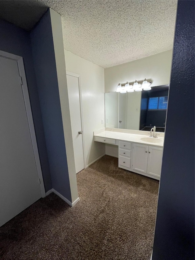 bathroom featuring vanity and a textured ceiling