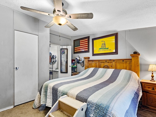 carpeted bedroom with a textured ceiling, a closet, vaulted ceiling, and ceiling fan