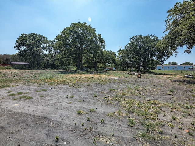 view of yard with a rural view