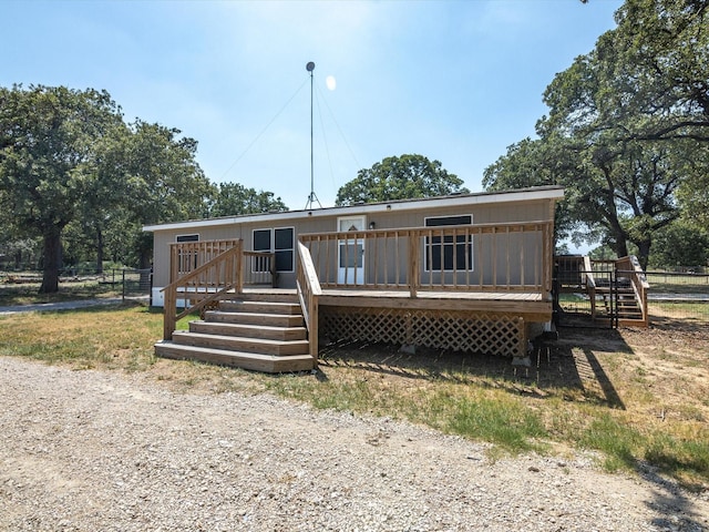 view of front of house with a wooden deck